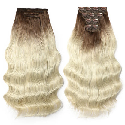 Two hair extensions with brown to blonde gradient on a white background