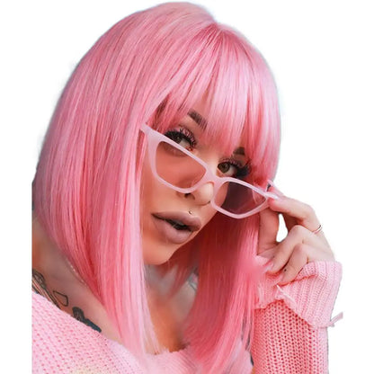 Person with pink hair wearing pink glasses and a pink outfit on a white background