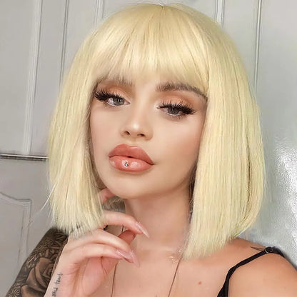 Person with a blonde bob wig posing against a neutral background