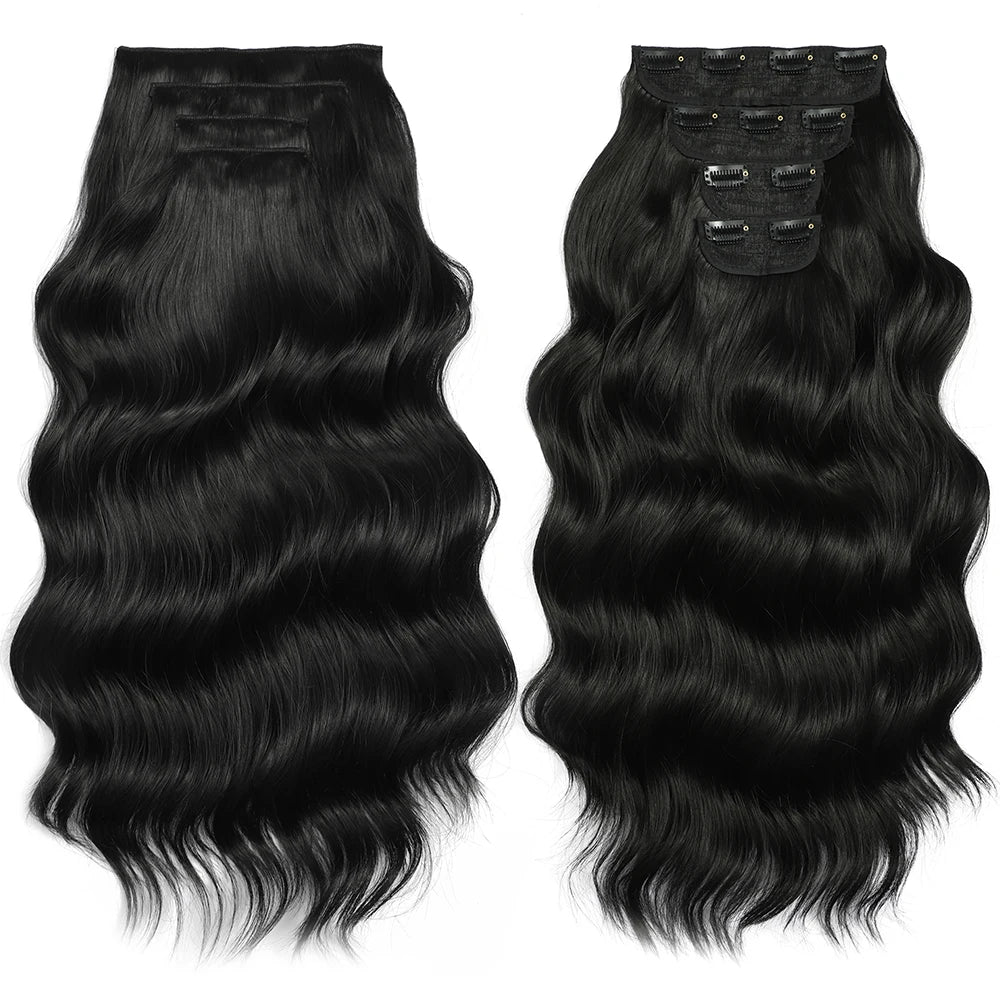 Two sets of black hair extensions with clips on a white background
